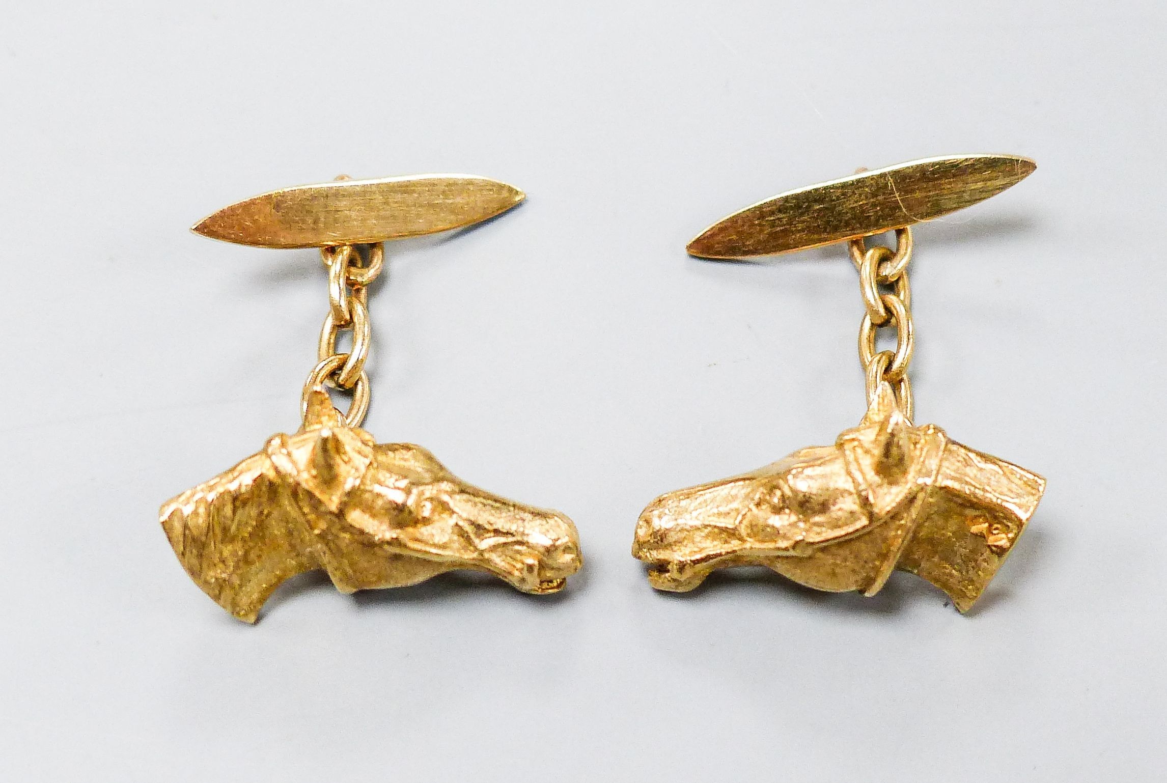 A modern pair of 9ct gold horse head cufflinks, 20mm, 10.3 grams.